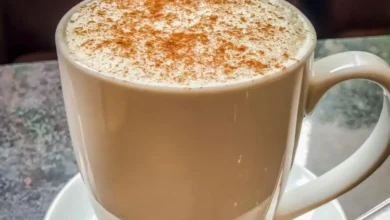 A steaming cup of Starbucks Vanilla Chai Latte